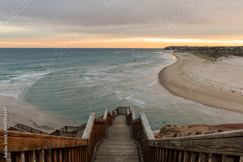 Sunrise ove the iconic boardwalk at southport port noarlunga south australia on may 18th 2021 photo