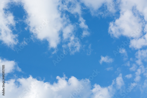 View with light clouds on a blue sky background