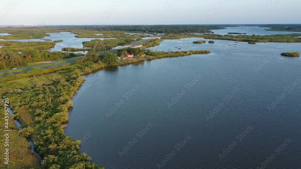 Aerial of Florida coastal basin watershed including Spruce Creek, Strickland Bay, and Turnbull Bay. Also features a US 1 causeway bridge between Port Orange and New Smyrna Beach over the Spruce Creek 