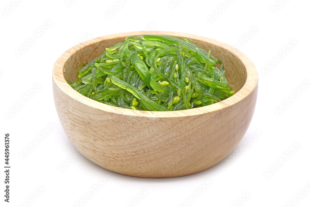Chuka Wakame Salad in wooden bowl isolated on white background. Famous Japanese appetizer Chuka Wakame Salad in wooden bowl isolated on white background. Famous Japanese appetizer