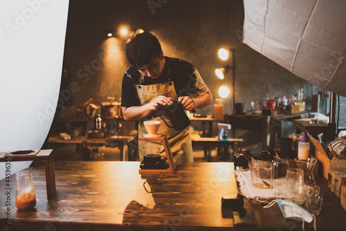barista brewing a coffee fi...
