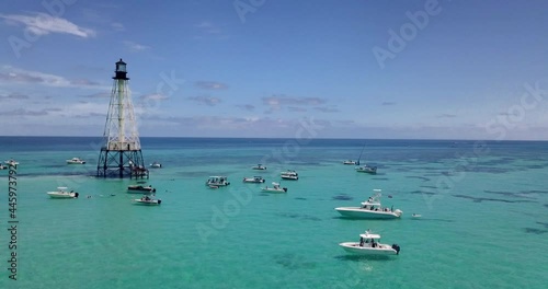 Drone over boats and Alligator Lighthouse in Islamorada, Florida Keys, in Atlantic Ocean. shot on Mavic Pro in 4k. photo