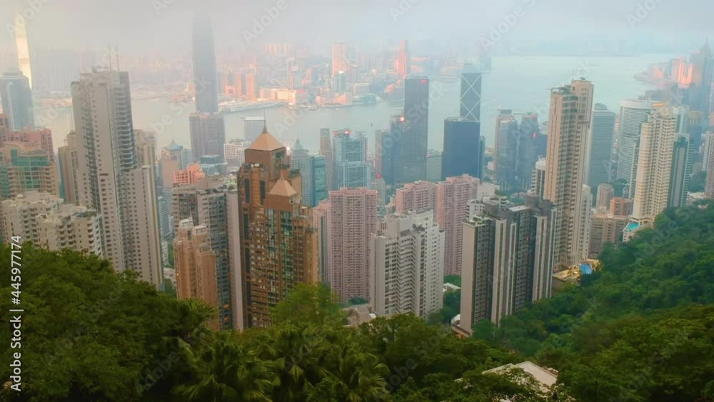 Aerial View Of Victoria Harbor With Hong Kong Skyline And Urban Skyscrapers In The Day - drone shot
Aerial View Of Victoria Harbor With Hong Kong Skyline And Urban Skyscrapers In The Day - drone shot