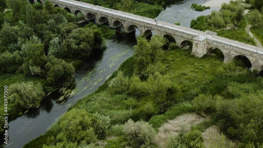 Roman Bridge Of Salamanca Over The Tormes River On The Banks Of The Spanish City Of Salamanca. aerial, orbit Roman Bridge Of Salamanca Over The Tormes River On The Banks Of The Spanish City Of Salamanca. aerial, orbit