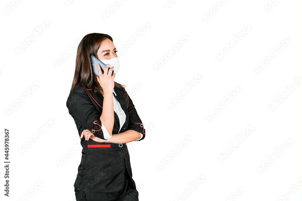 Businesswoman in mask makes phone call on studio Businesswoman in mask makes phone call on studio