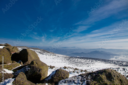 Stones in the mountains with snow 1