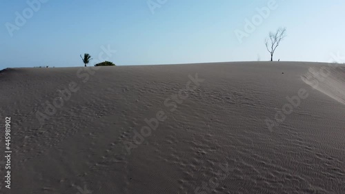 Aerial view of a drone flying over massive sand dunes photo