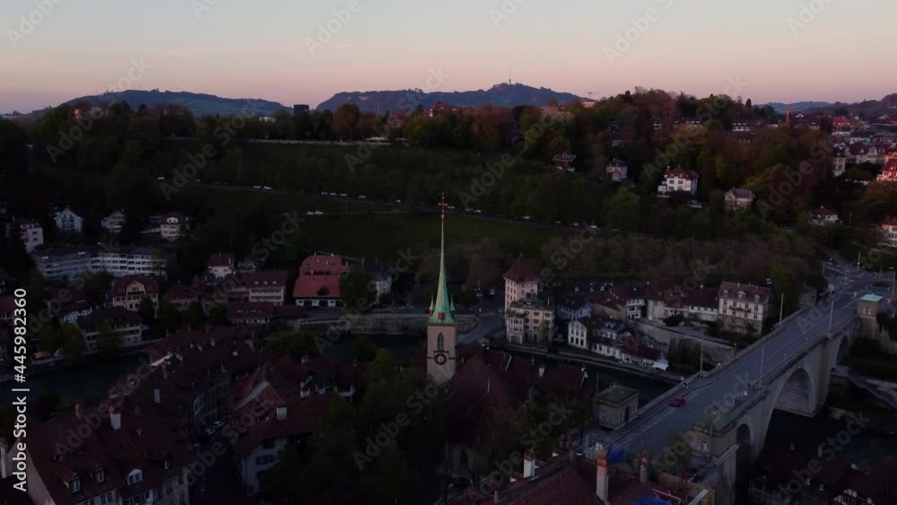 Drone flight above the city of Berne in Switzerland, at sunset