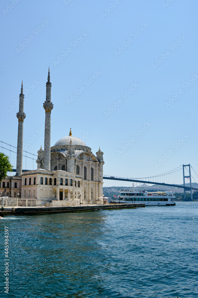 Naklejka premium Ortakoy Mosque near the Bosphorus Bridge on the Bosphorus pier