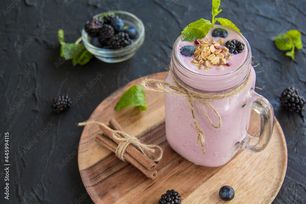 Healthy smoothie of fresh summer berries. Creative atmospheric decoration