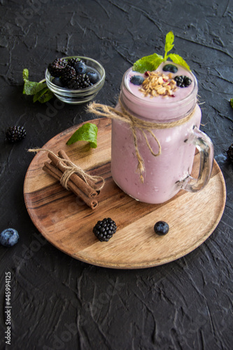 Healthy smoothie of fresh summer berries. Creative atmospheric decoration