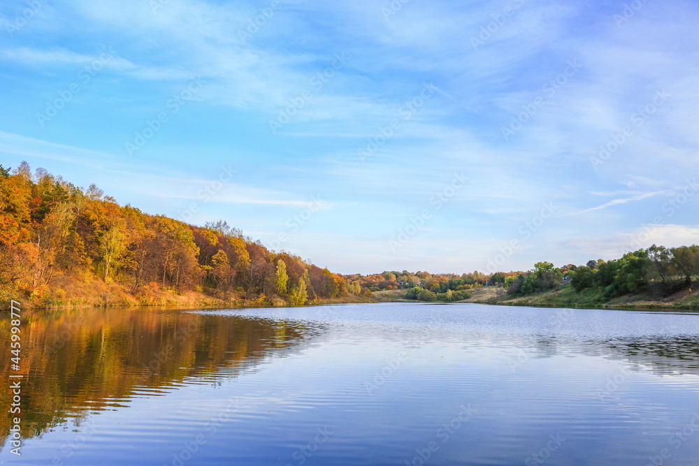 beautiful big lake in the forest in autumn