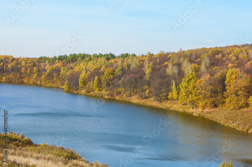 beautiful big lake in the forest in autumn