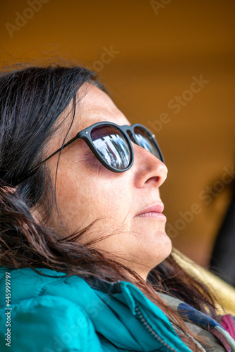 Woman relaxing and sleeping wearing sunglasses.