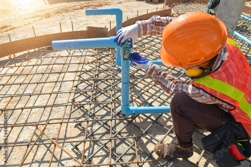 Technician with Laser measurement level during work