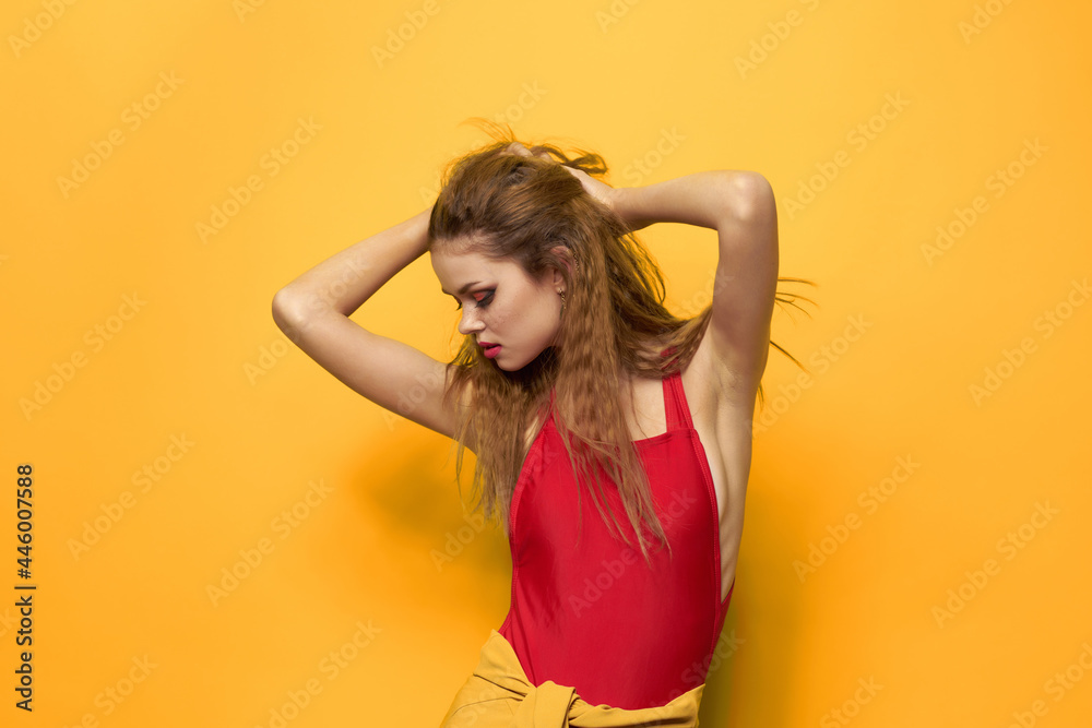 pretty woman in red t-shirt cosmetics decoration fashion yellow background pretty woman in red t-shirt cosmetics decoration fashion yellow background