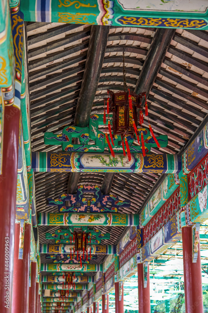 Fototapeta premium Chinese traditional corridor with painted palace lanterns in Baomo Garden, Guangzhou, China