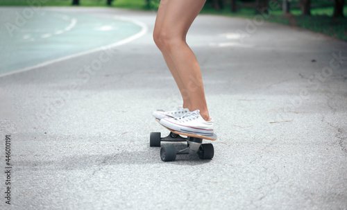 Asian women leg on surf skate or skate board. Sport activity lifestyle concept, Healthy and exercise.