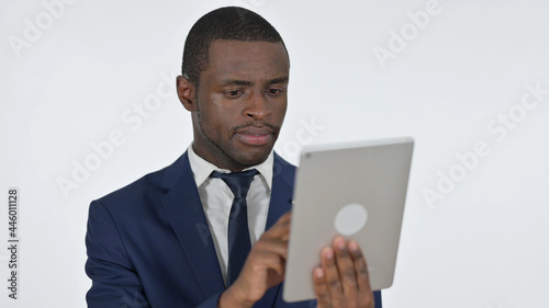 African Businessman Using Tablet for Internet, White Background