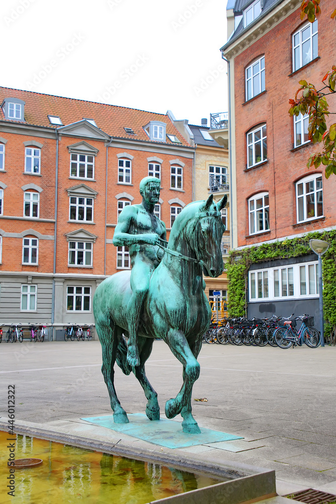 Equestrian statue or monument in bronze, Aalborg, Denmark. Surrounded by historic buildings, in the city centre of Aalborg.
