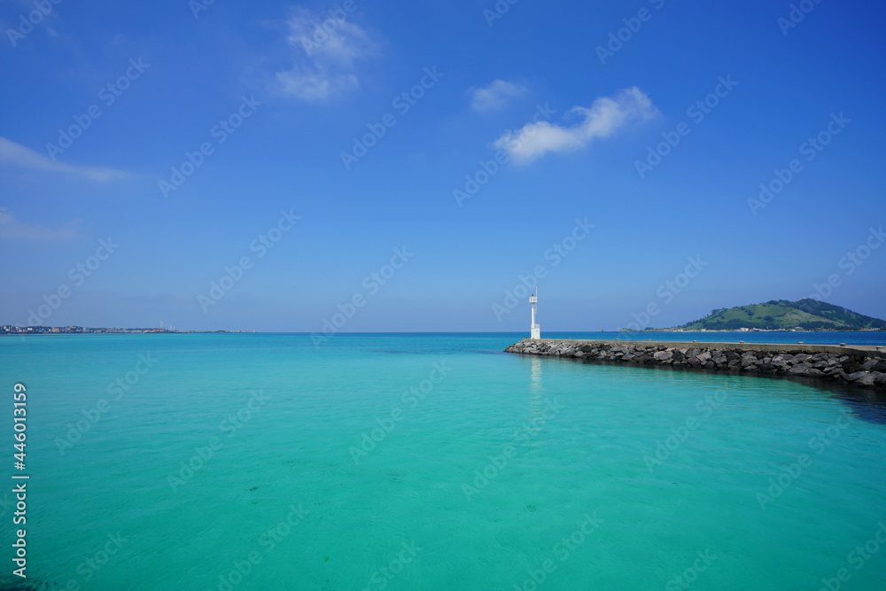 a beautiful seascape with a lighthouse