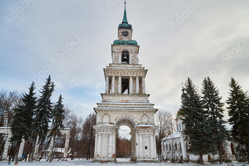 Orthodox white Cathedral church with spires, domes, a cross on a winter day and snow around in Russia