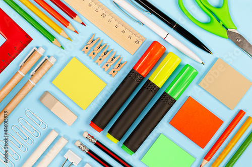 Tableau sur toile various stationery on a light blue background, knolling technique
