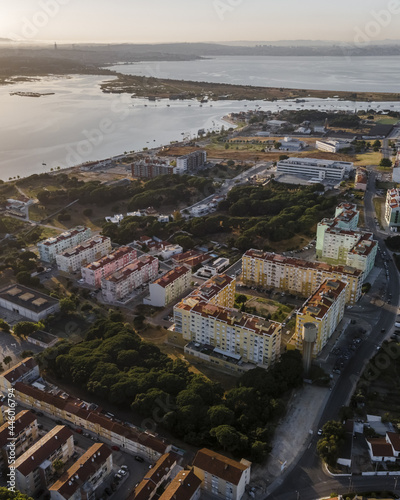 Aerial view of Seixal along the lagoon with Tagus river in the background at sunset, Seixal