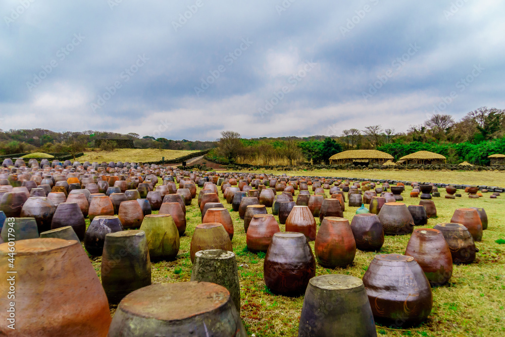JEJU ISLA, KOREA, SOUTH - Apr 04, 2016: Landscape of the Jeju Stone Park under a cloudy sky in Jeju Island, South Korea JEJU ISLA, KOREA, SOUTH - Apr 04, 2016: Landscape of the Jeju Stone Park under a cloudy sky in Jeju Island, South Korea