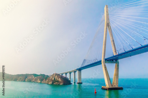 MOKPO, KOREA, SOUTH - Apr 02, 2016: Mokpo Bridge over the sea under the sunlight and a blue sky in South Korea