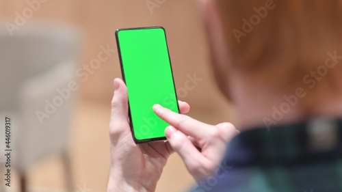 Redhead Man Using Smartphone with Green Chroma Screen 