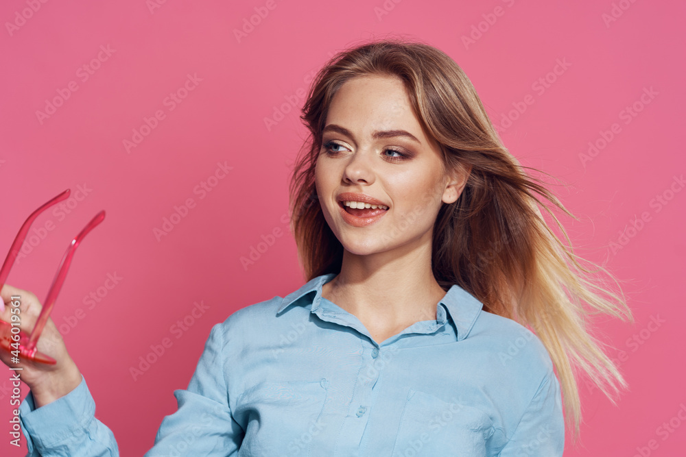 woman in blue shirt pink glasses fashion glamor posing pink background woman in blue shirt pink glasses fashion glamor posing pink background