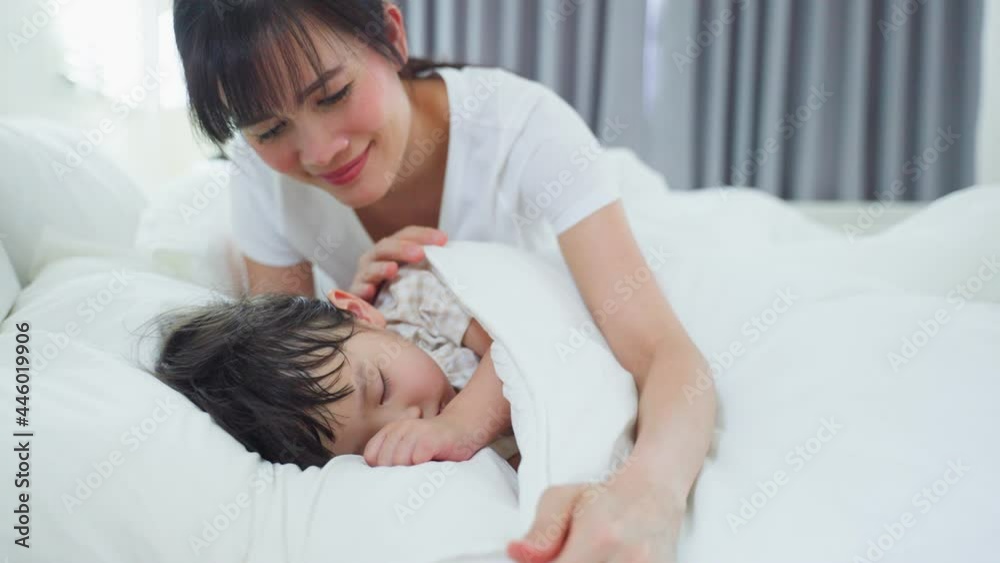 Asian loving beautiful mother take care asleep young comfortable kid. Asian loving beautiful mother take care asleep young comfortable kid.