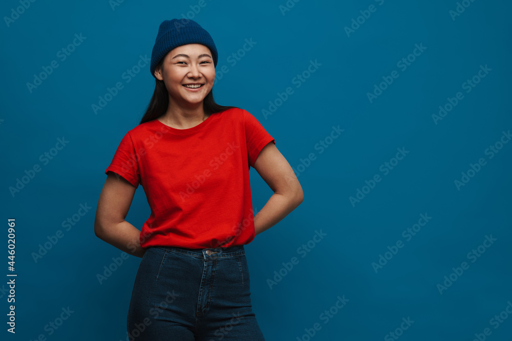 Portrait of a casual young asian woman standing