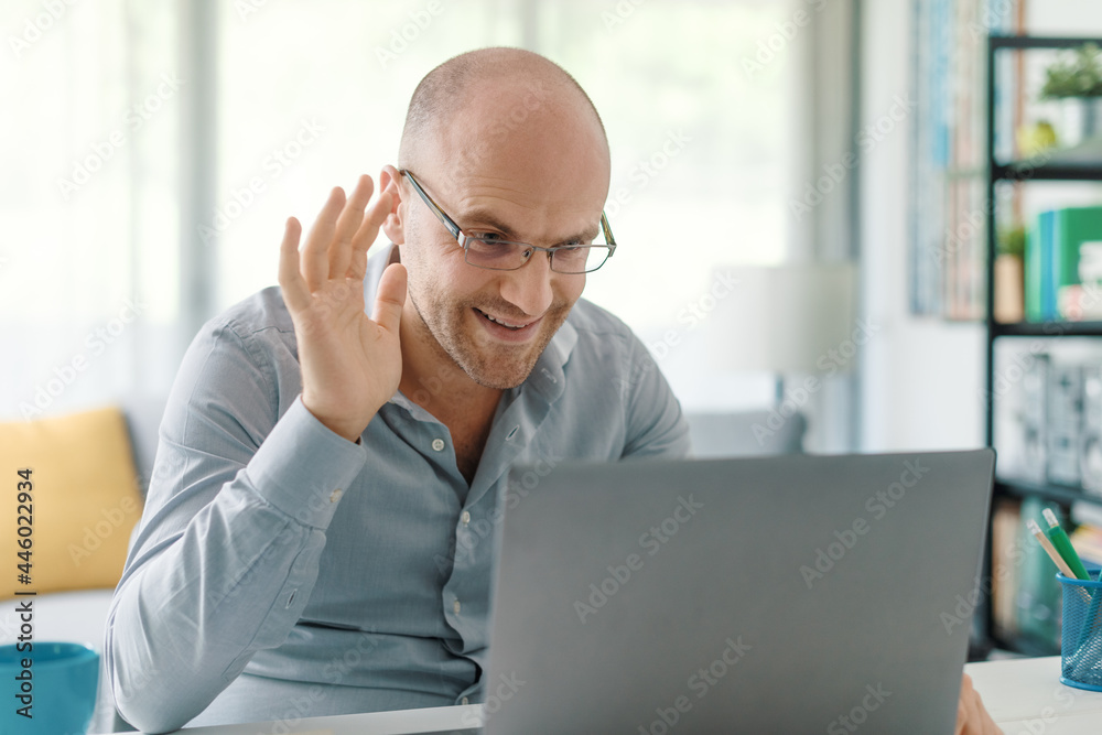 Businessman working from home and video conferencing Businessman working from home and video conferencing