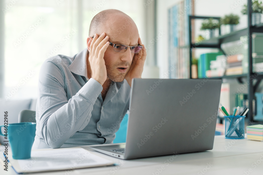 Stressed man working from home Stressed man working from home