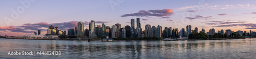 Panoramic view of beautiful Vancouver skyline and famous harbor area from stanley park in idyllic evening light at sunset in summer  British Columbia  Canada