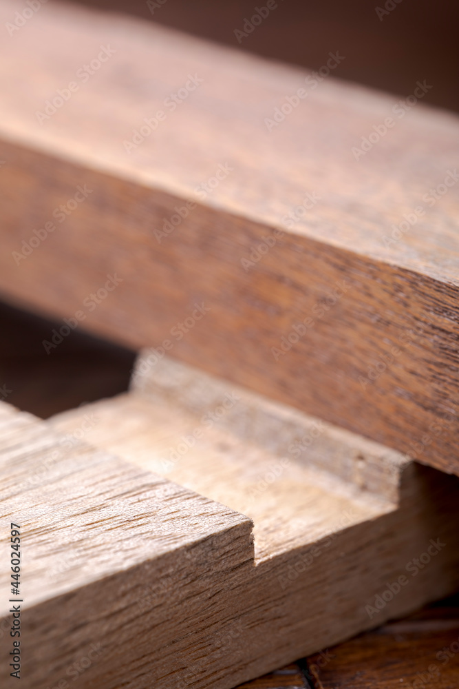 Wooden planks of hardwoods. Wooden blocks with a locksmith connection. Abstract wooden shapes. Wooden planks of hardwoods. Wooden blocks with a locksmith connection. Abstract wooden shapes.