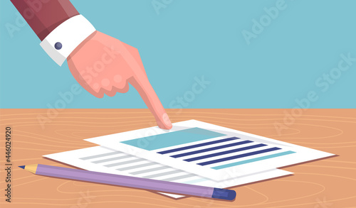 Businessman in business clothes points with his hand to document. Sheet of paper on table with pencils. Finger pointing to important in document. Viewing, reading document pay attention to significant