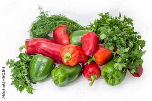 Green and red bell peppers among the different greens