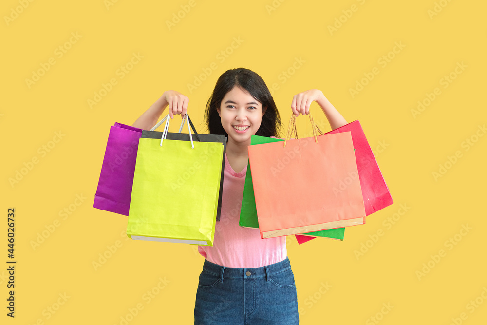 Asian woman in summer. She smiling and has happy shopping bags. Summer Surprise Sale concept..