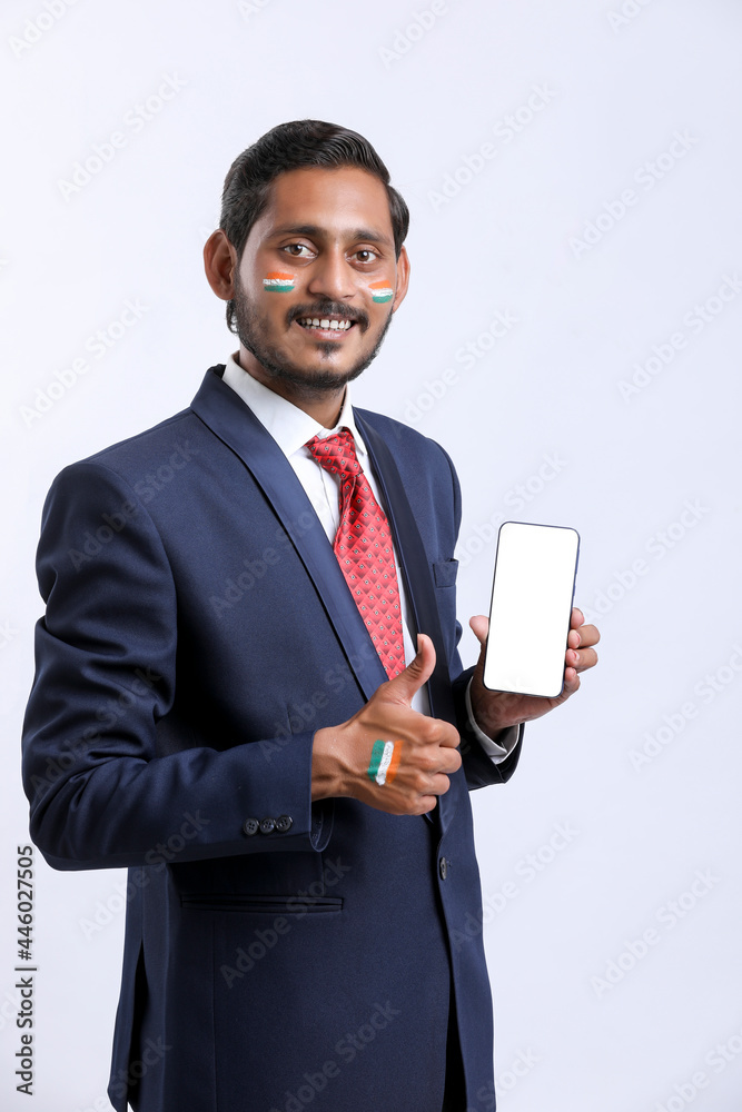 Independence day offer concept : Young indian showing smartphone. Independence day offer concept : Young indian showing smartphone.
