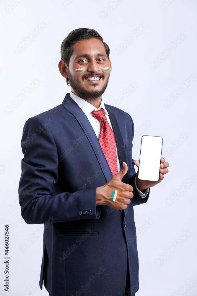 Independence day offer concept : Young indian showing smartphone. Independence day offer concept : Young indian showing smartphone.