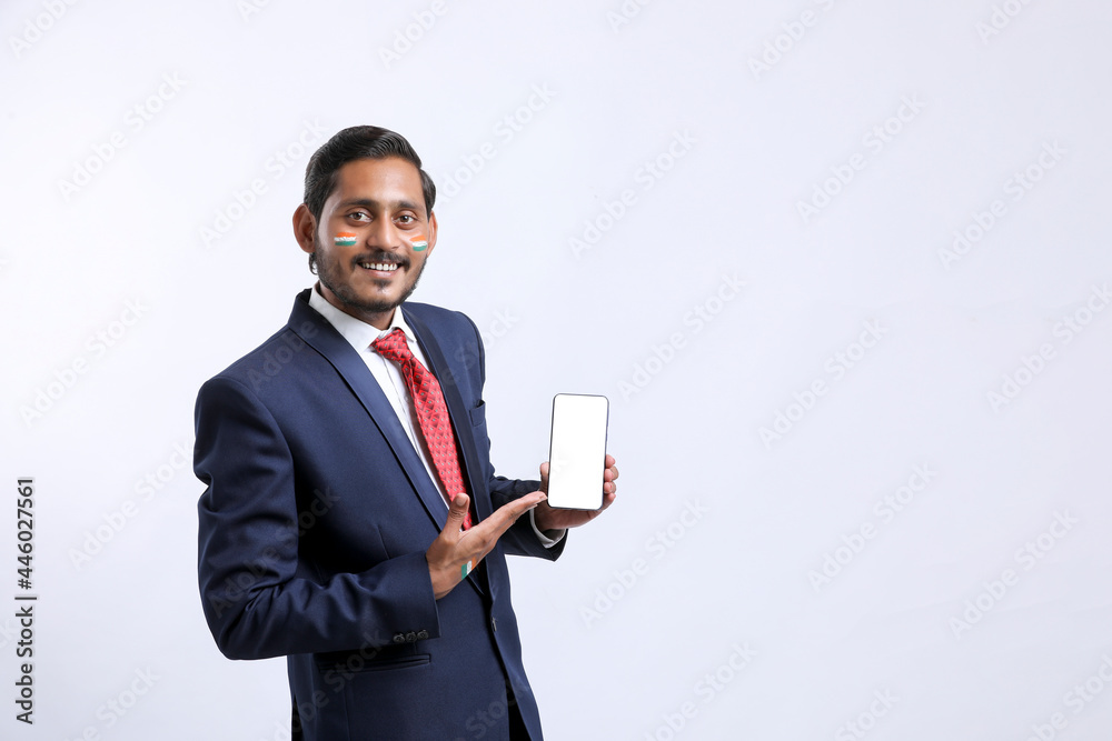 Independence day offer concept : Young indian showing smartphone. Independence day offer concept : Young indian showing smartphone.