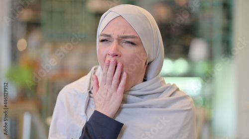 Portrait of Exhausted Young Arab Woman Yawning 
