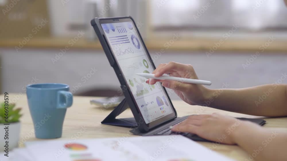 Hand of woman as businesswoman working with technology of laptop computer doing person finance for her business budget at home office