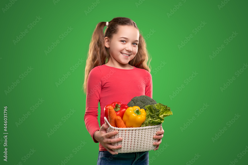 Cheerful child with assorted vegetables