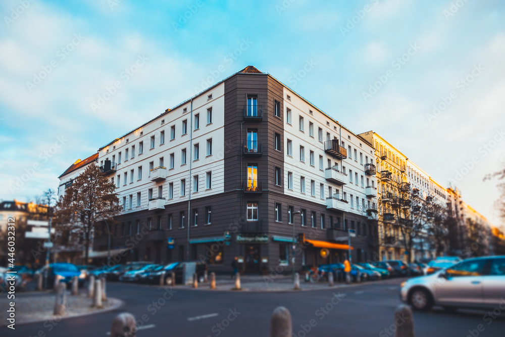 intersection in berlin, prenzlauer berg with shops and beautiful apartment building