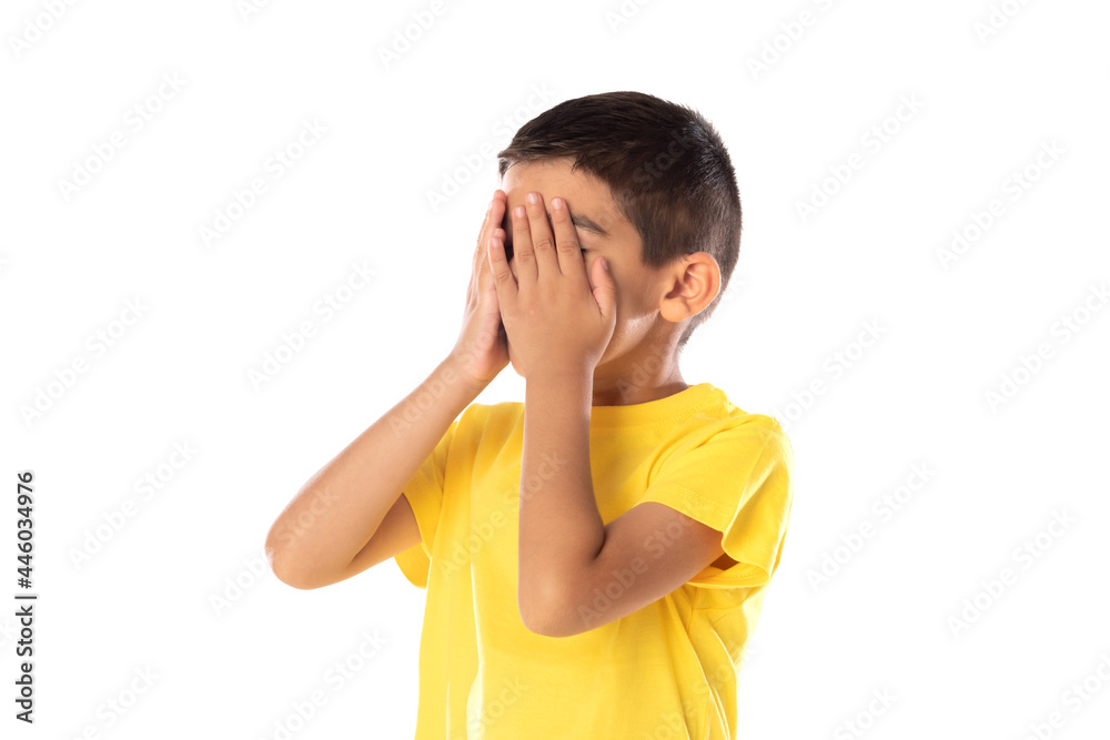 Worried latin boy weraring a yellow t-shirt Worried latin boy weraring a yellow t-shirt
