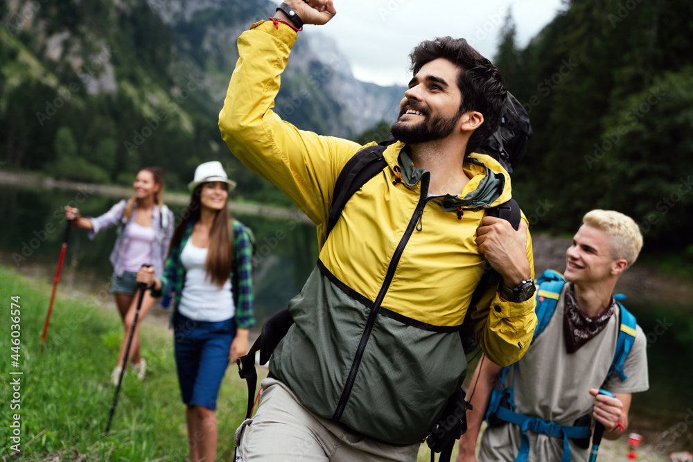 Group of happy hiker friends trekking as part of healthy lifestyle outdoors activity Group of happy hiker friends trekking as part of healthy lifestyle outdoors activity